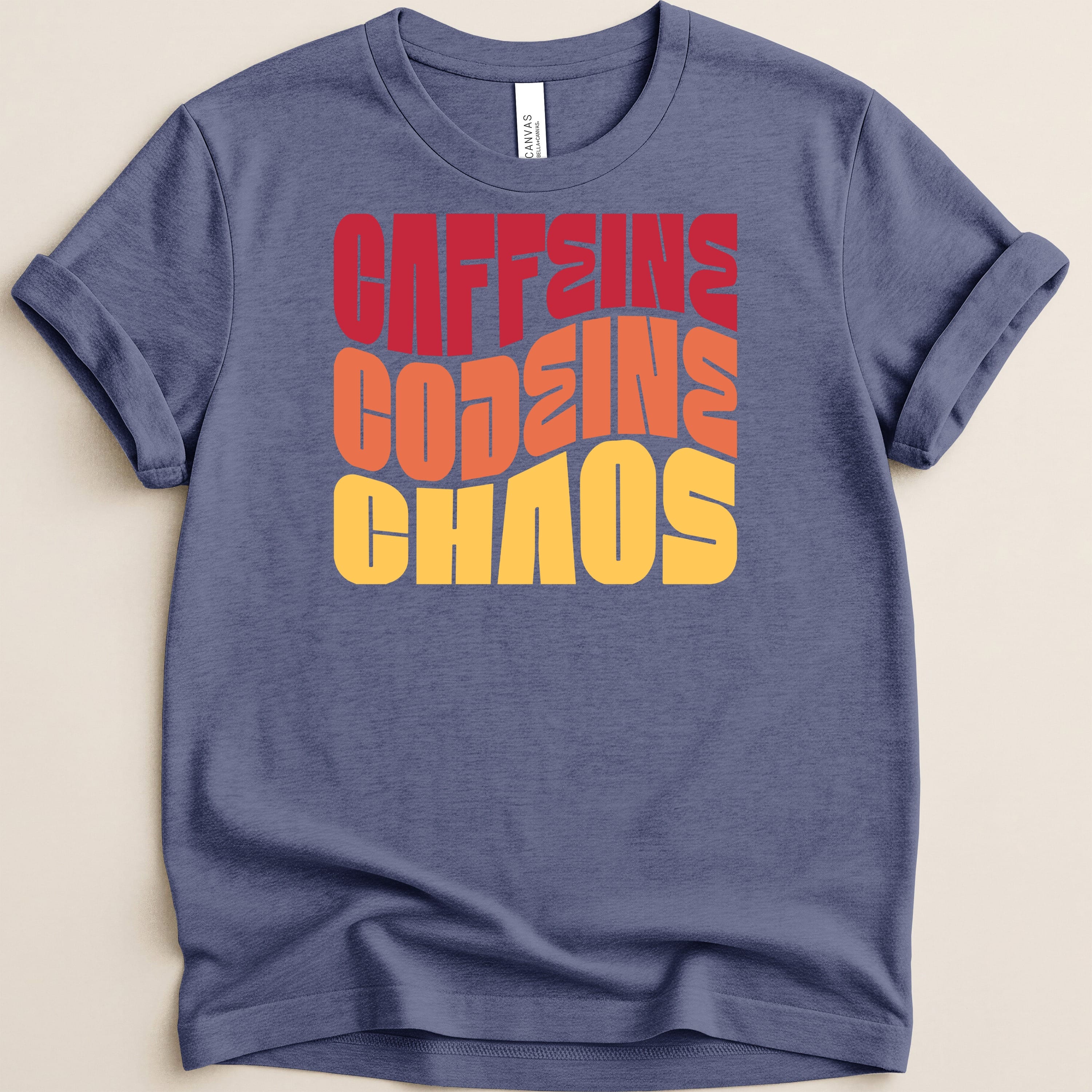 T-shirt with "CAFFEINE CODEINE CHAOS" in layered red, orange, and yellow text.