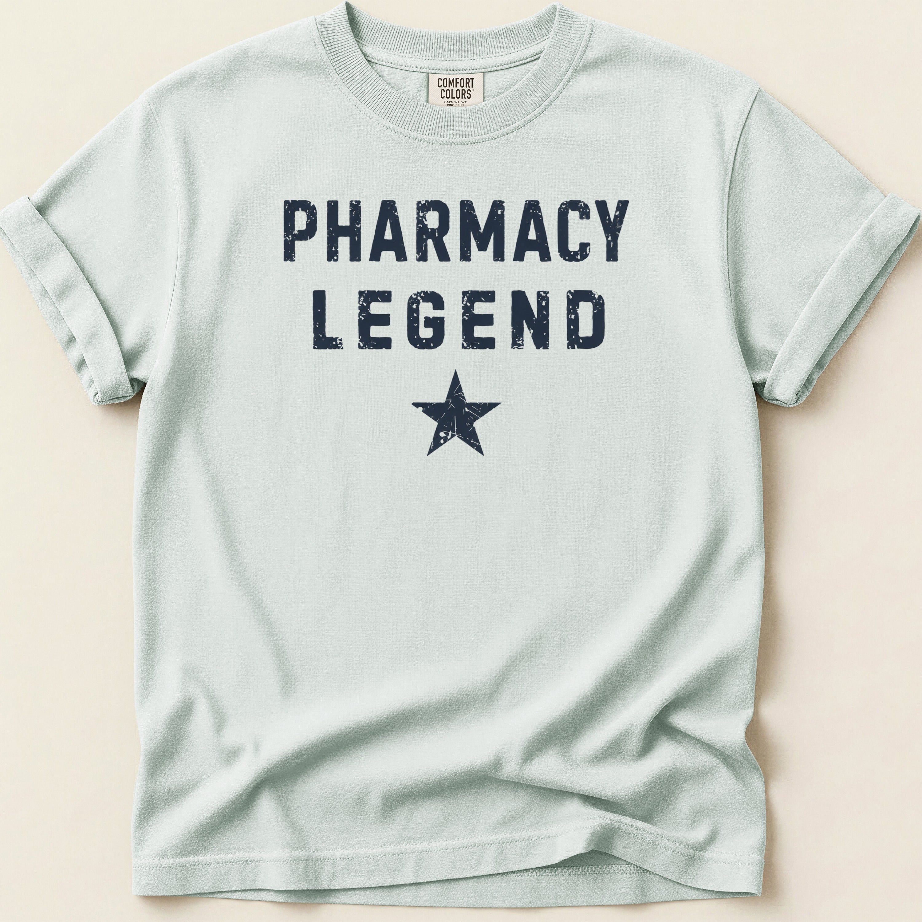 Light blue t-shirt with "PHARMACY LEGEND" and a star.