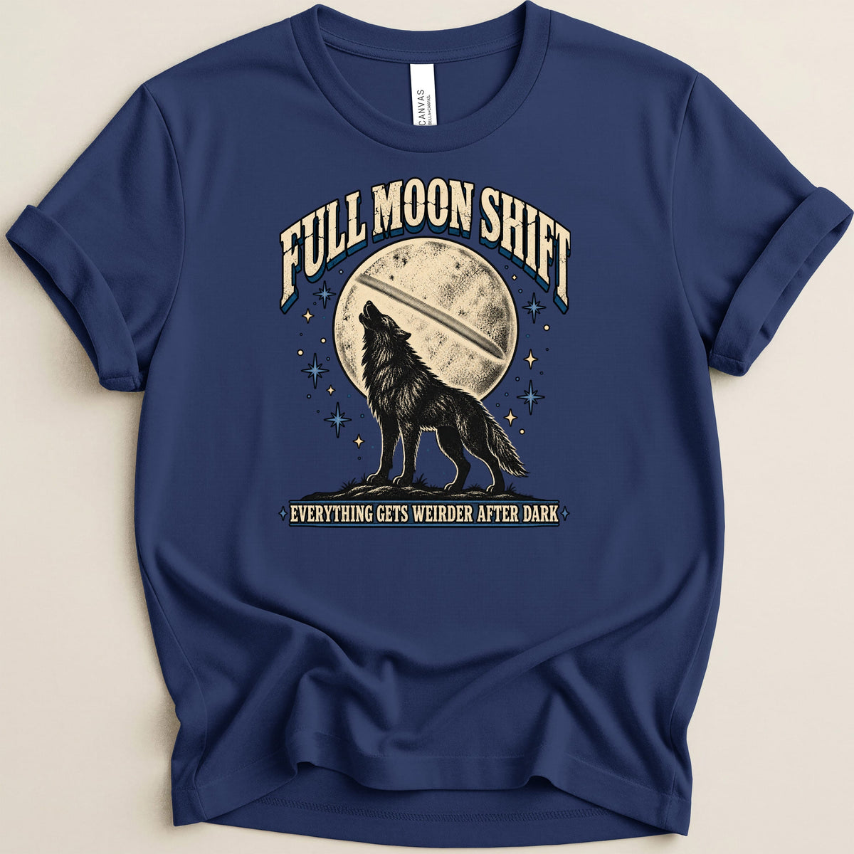 Dark blue t-shirt with a wolf howling at the moon, "Full Moon Shift" and "Everything Gets Weirder After Dark" text.
