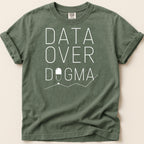Green t-shirt with "DATA OVER DOGMA" text and capsule graphic.