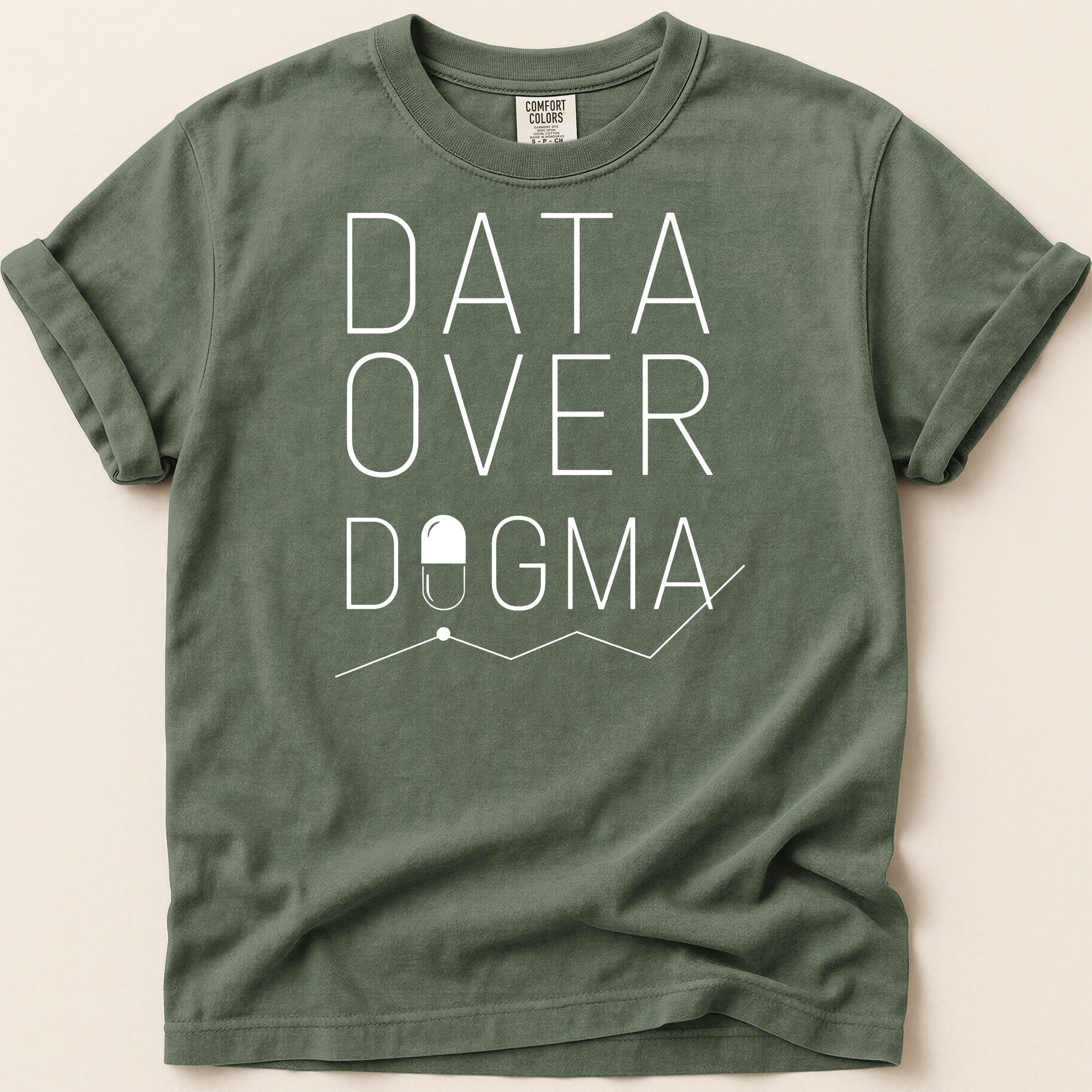 Green t-shirt with "DATA OVER DOGMA" text and capsule graphic.