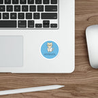Round sticker of a cat in glasses with text "pharmacologically speaking, i exhibit time-dependent toxicity."