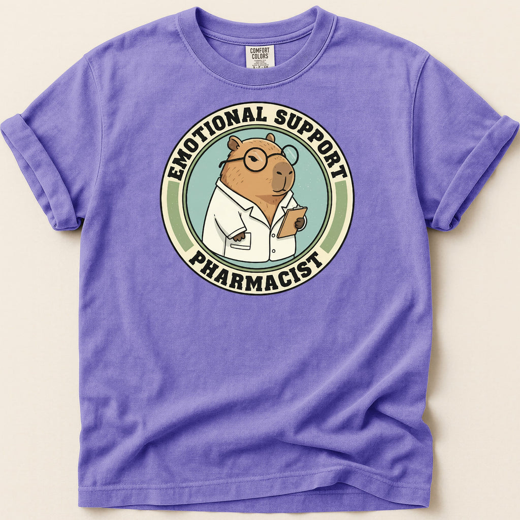 Capybara wearing glasses and lab coat, "Emotional Support Pharmacist" text on shirt.