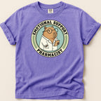 Capybara wearing glasses and lab coat, "Emotional Support Pharmacist" text on shirt.
