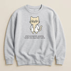 Gray sweatshirt with a cat wearing glasses and a lab coat, text reads "pharmacologically speaking, i exhibit time-dependent toxicity."