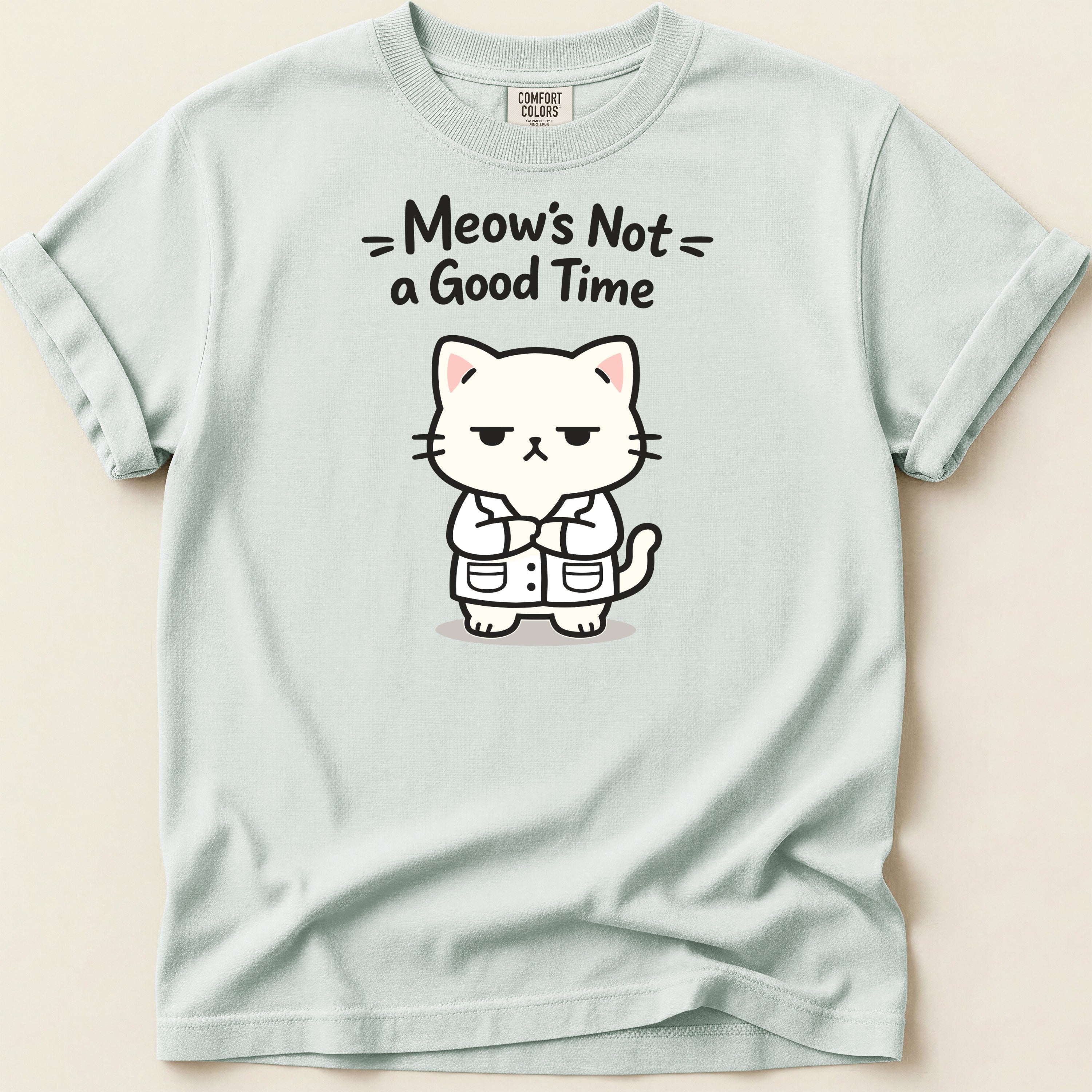Light blue t-shirt with grumpy cat graphic and text "Meow's Not a Good Time".