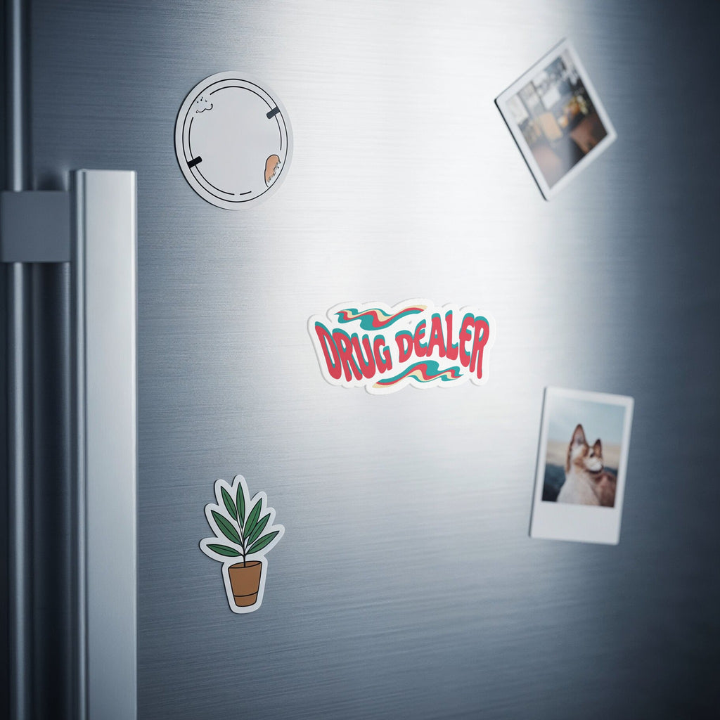 Sticker on a refrigerator door reads "DRUG DEALER" with floral and polaroid photos.