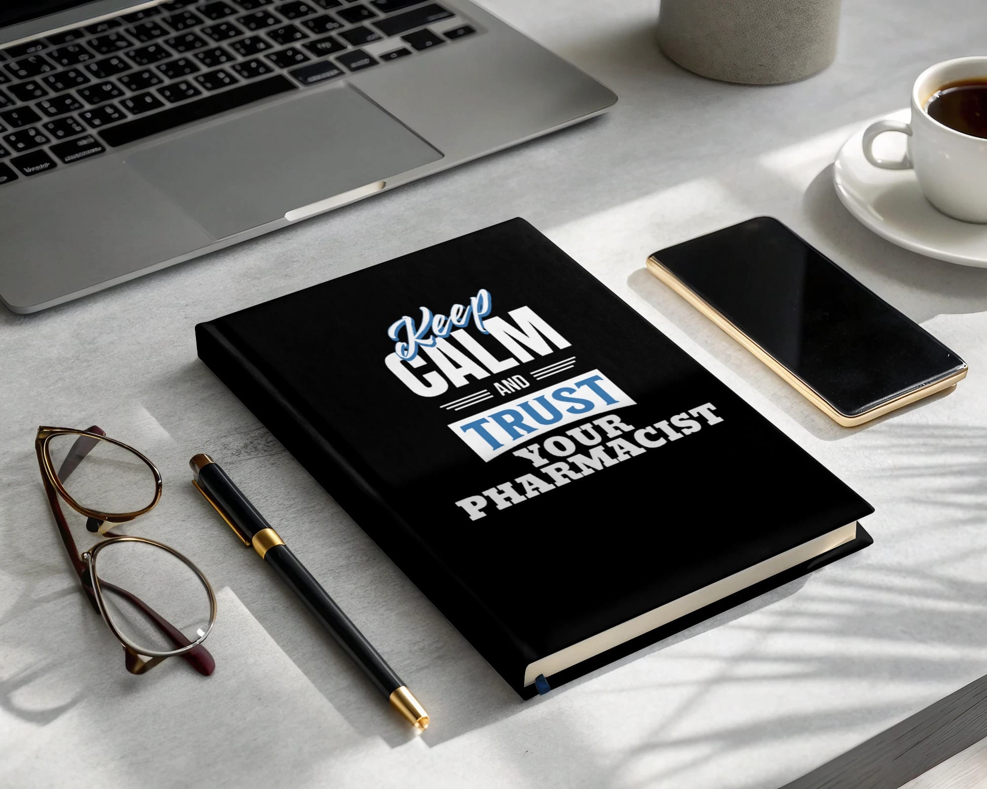 Black notebook with "Keep Calm and Trust Your Pharmacist" in white text.