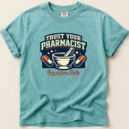 Teal t-shirt with "Trust Your Pharmacist" and mortar and pestle graphic.
