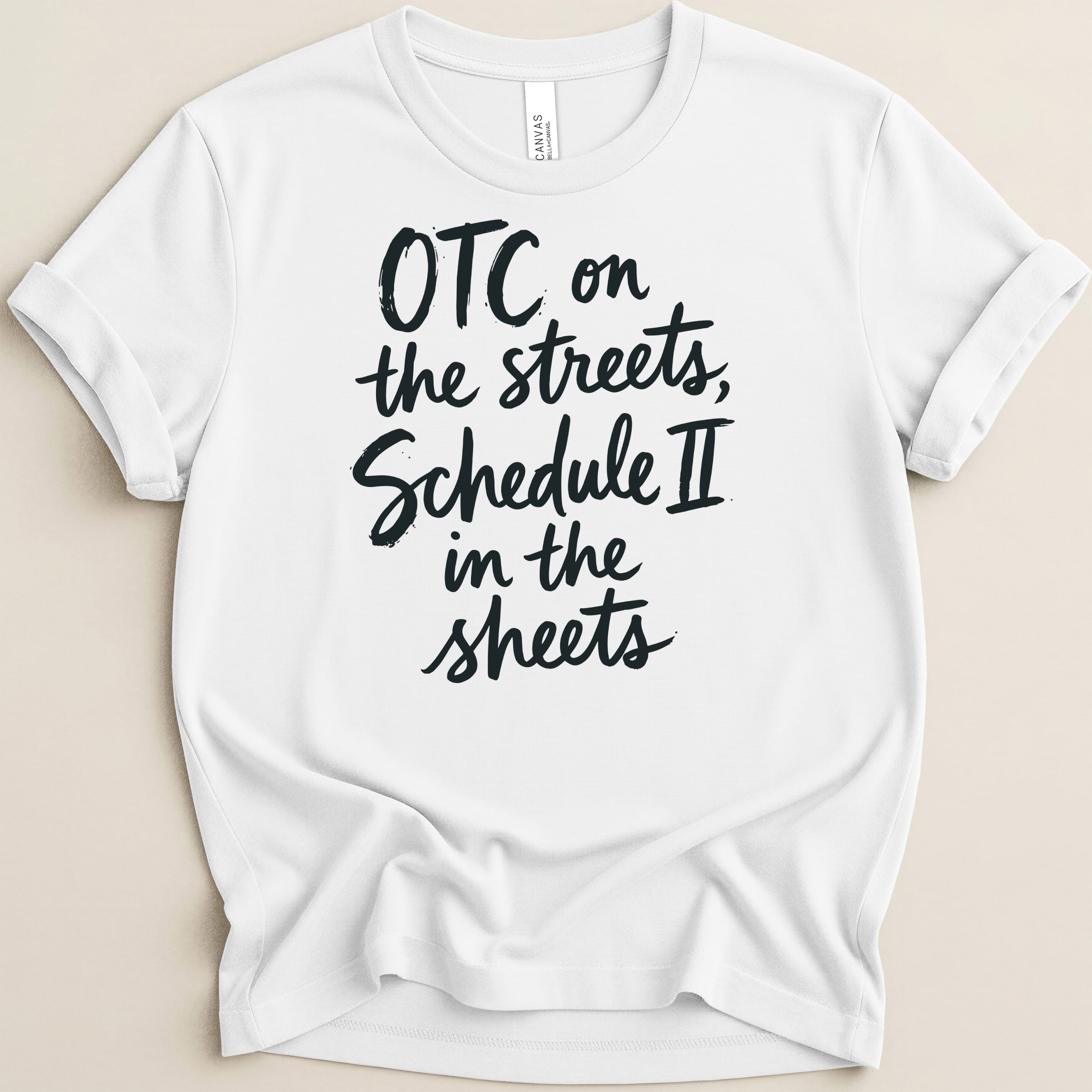 White t-shirt with black text: "OTC on the streets, Schedule II in the sheets."