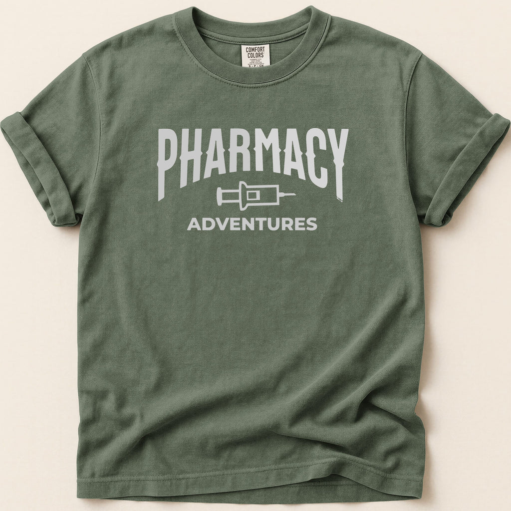 Green t-shirt with "Pharmacy Adventures" graphic in white.