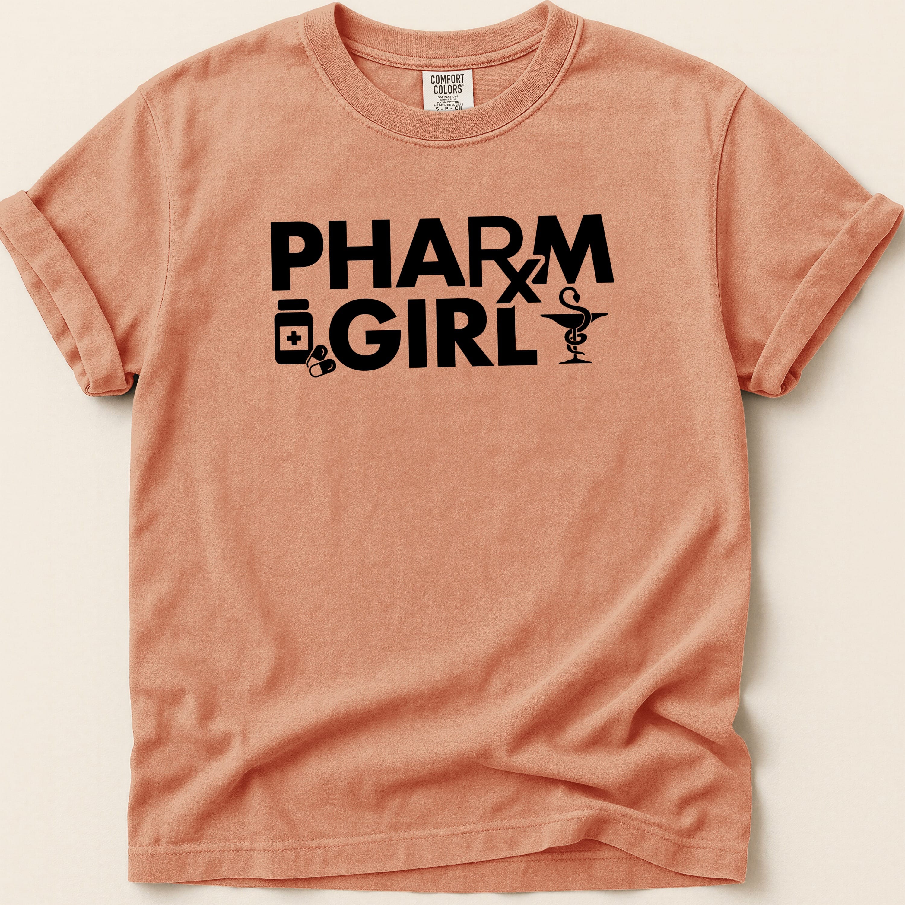Peach t-shirt with "PHARM GIRL" text and medical icons.