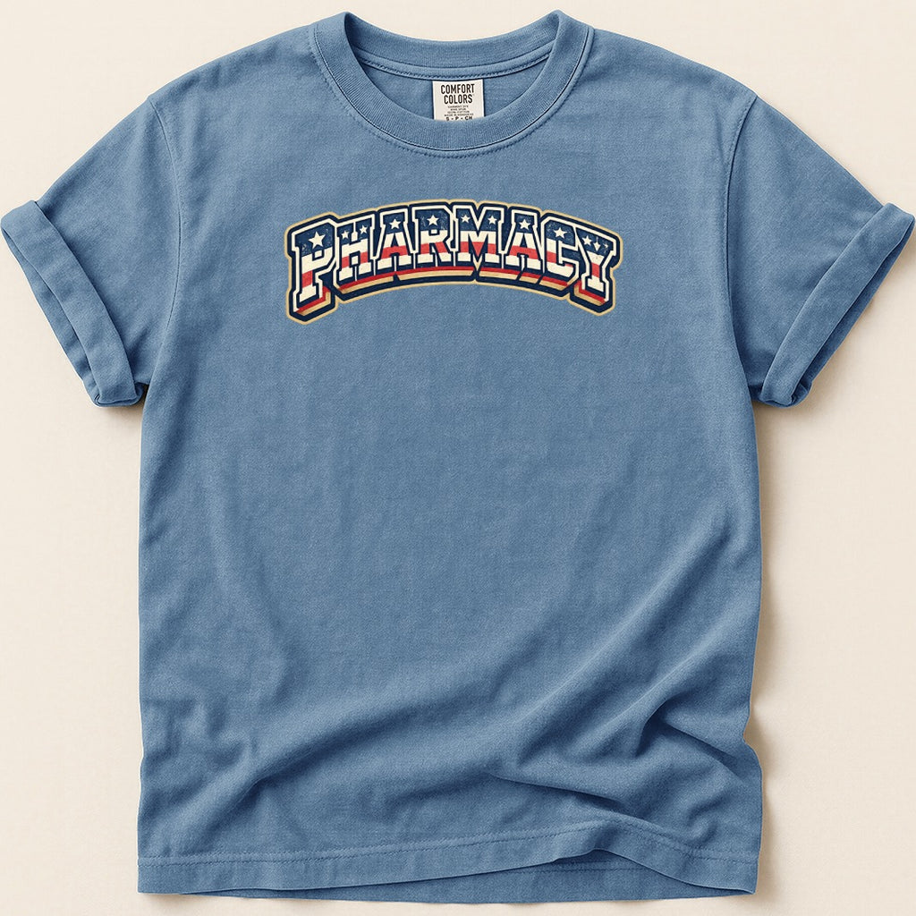 Blue t-shirt with "Pharmacy" text in red, white, and blue arched design.