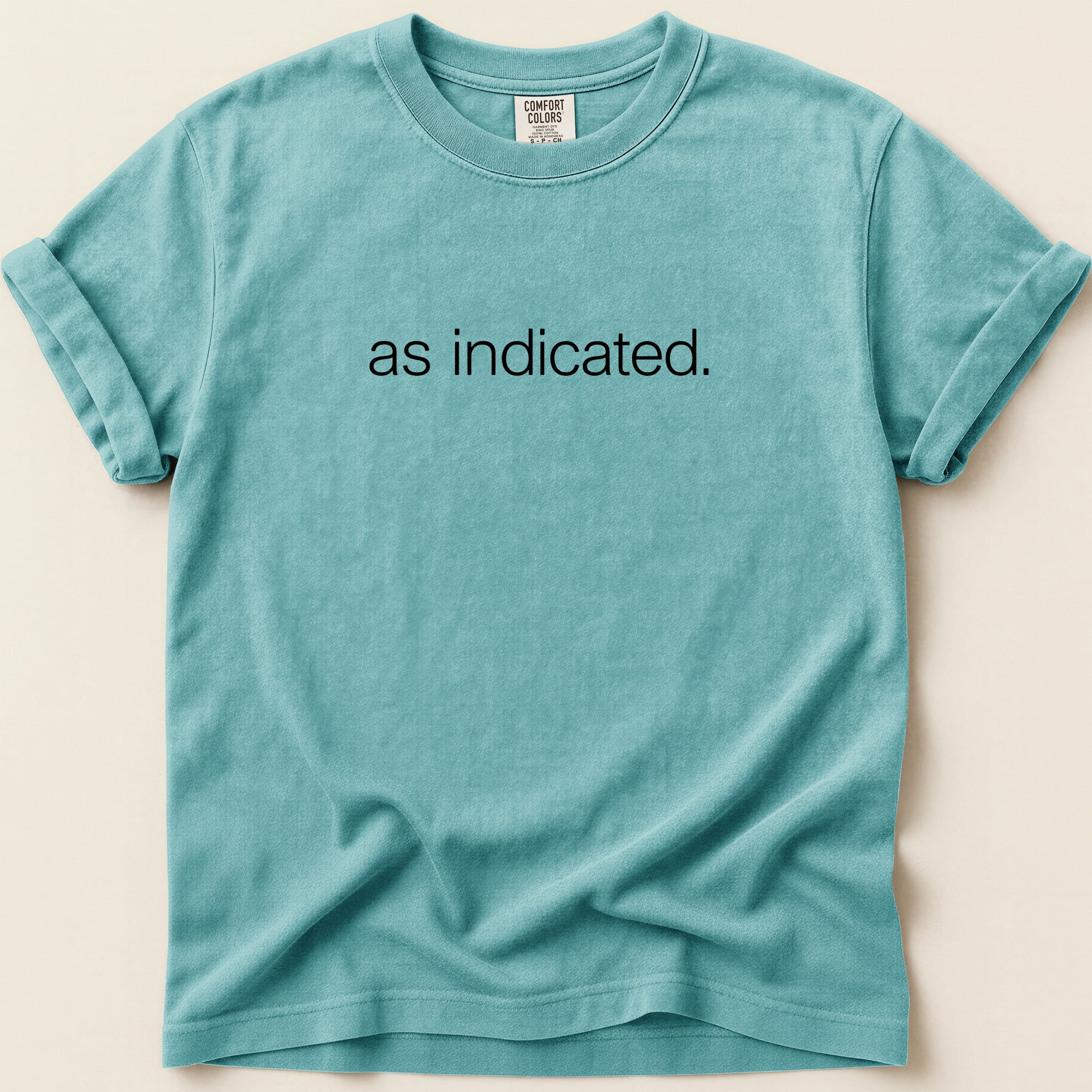 Teal t-shirt with "as indicated." printed in black text.
