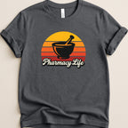 Dark t-shirt with a mortar and pestle and "Pharmacy Life" text.