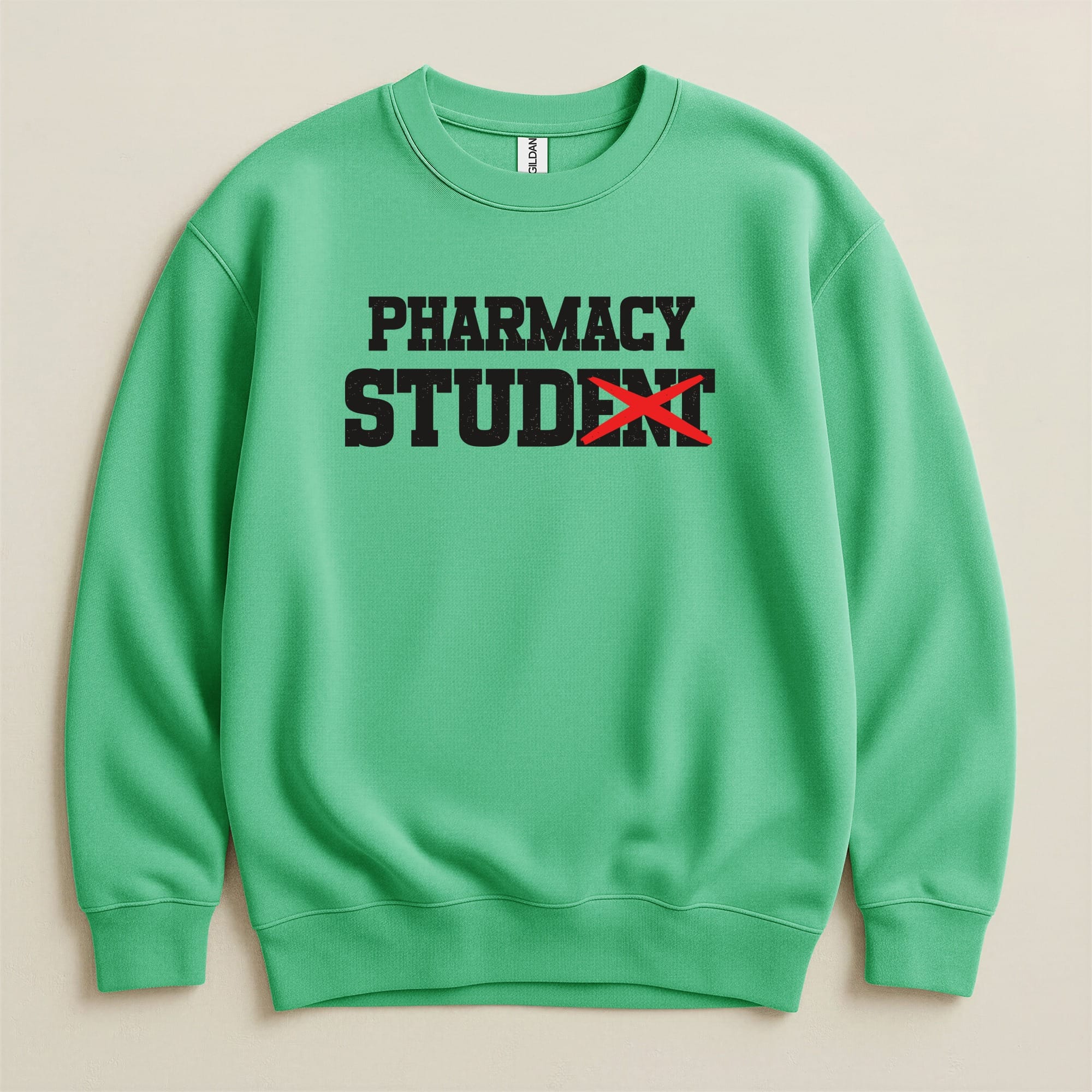 Green Gildan sweatshirt with "PHARMACY STUDENT" text, "STUDENT" crossed out.