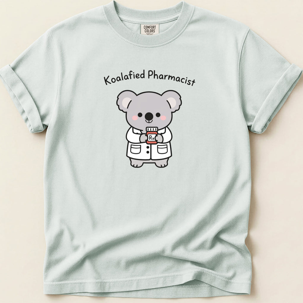 T-shirt with cartoon koala wearing lab coat holding Rx bottle, text "Koalafied Pharmacist".