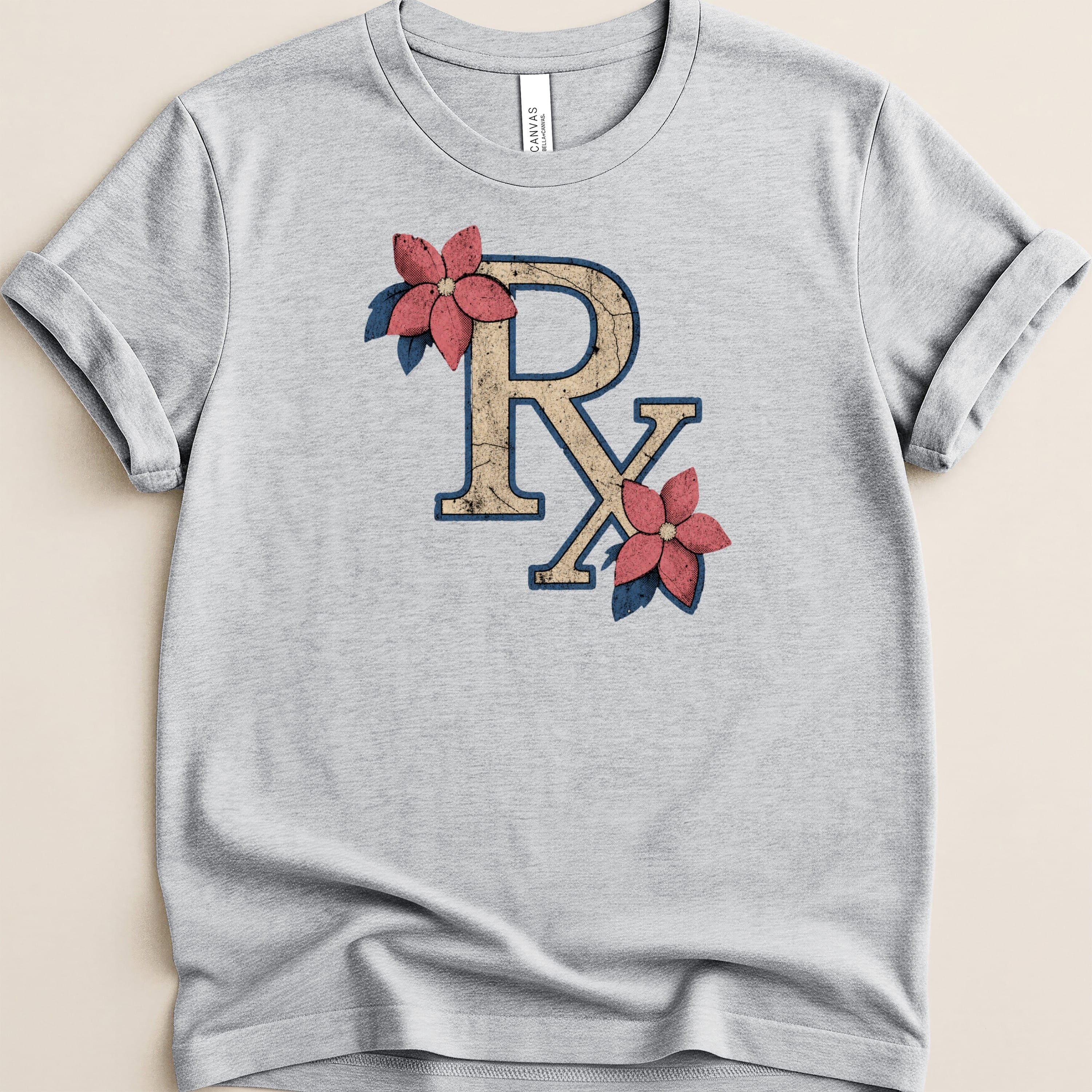 Light grey t-shirt with distressed Rx symbol and floral accents.