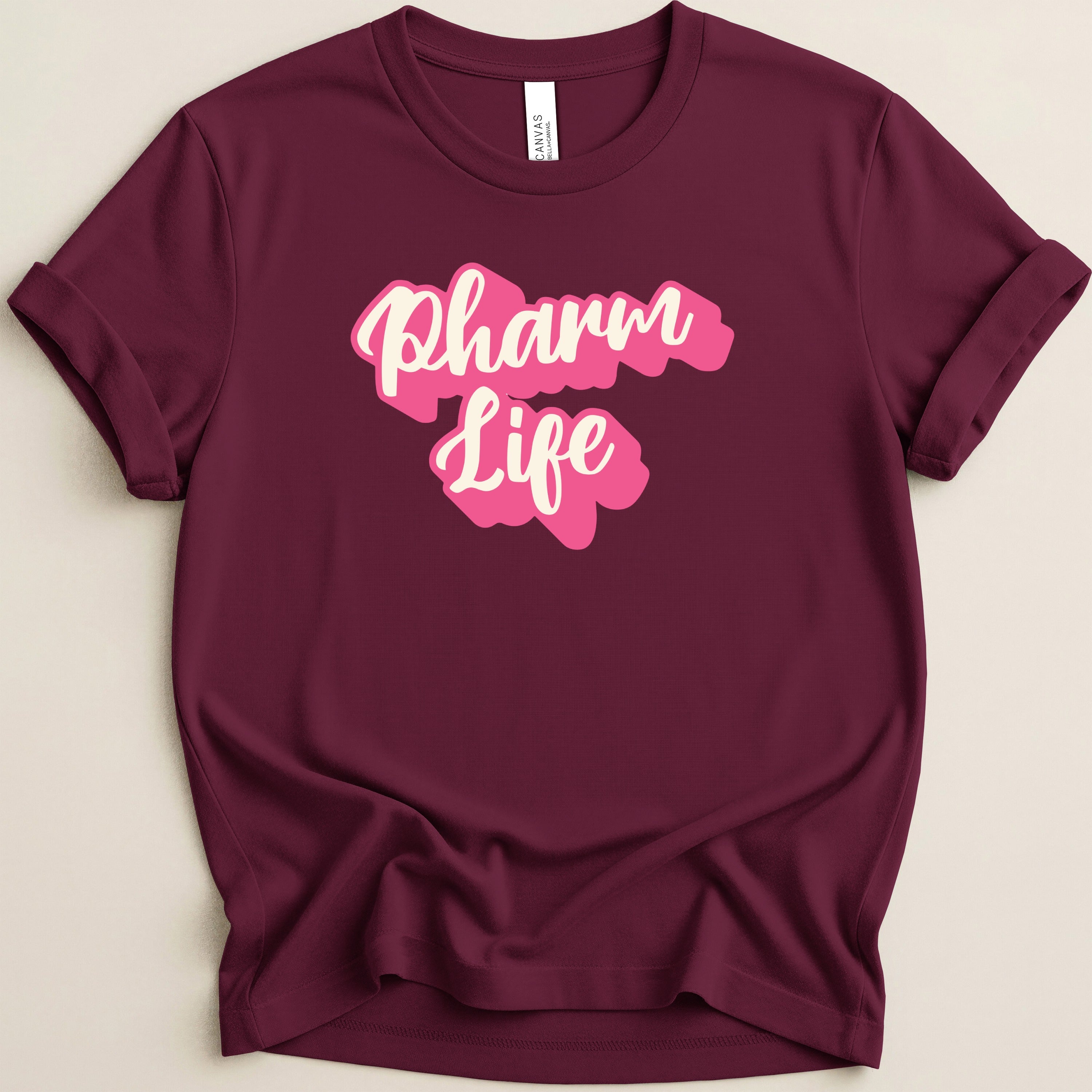 Maroon t-shirt with "Pharm Life" text in pink and white.