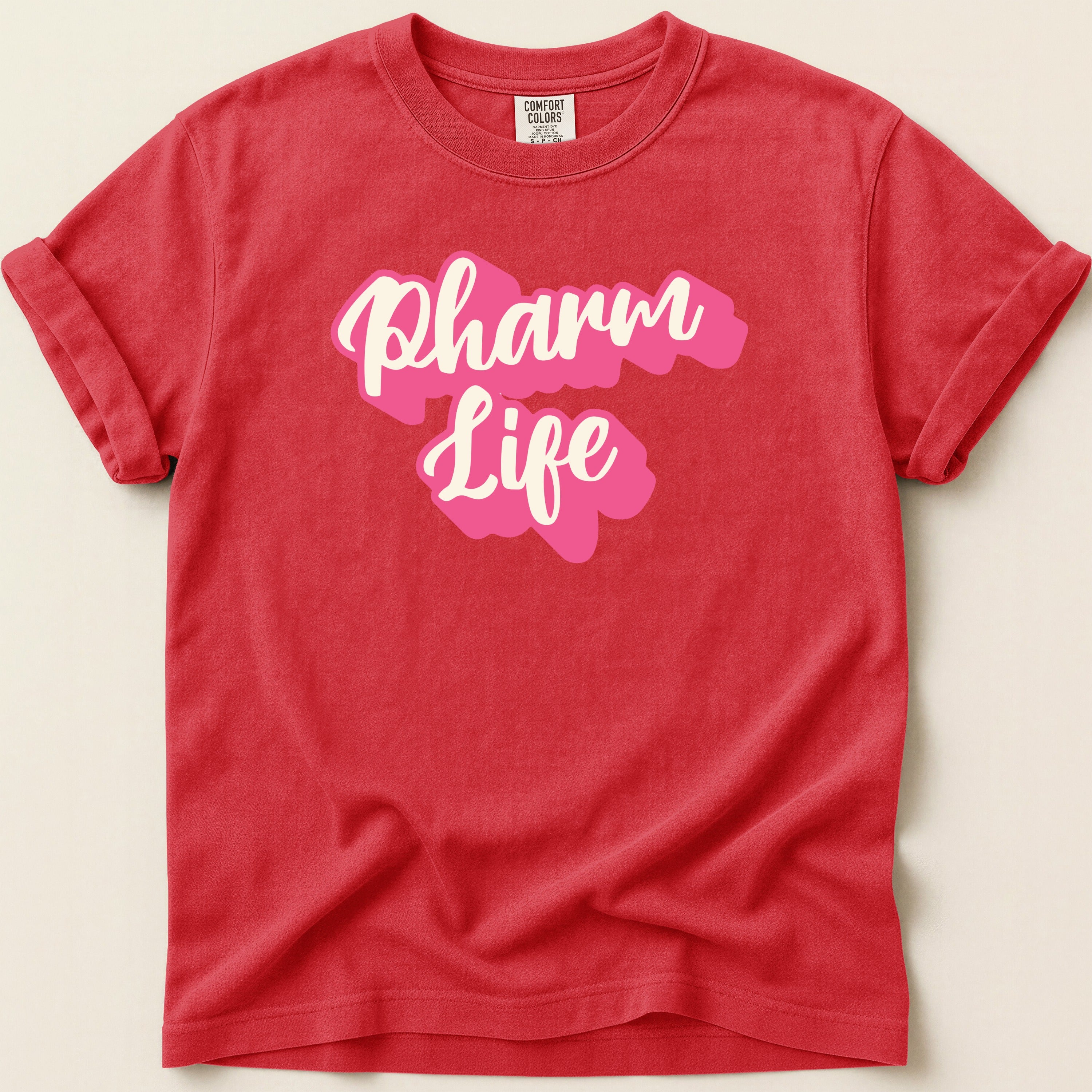 Red t-shirt with "Pharm Life" text in pink and white lettering.