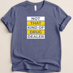Blue t-shirt with white and yellow text that reads "NOT THAT KIND OF DRUG DEALER".