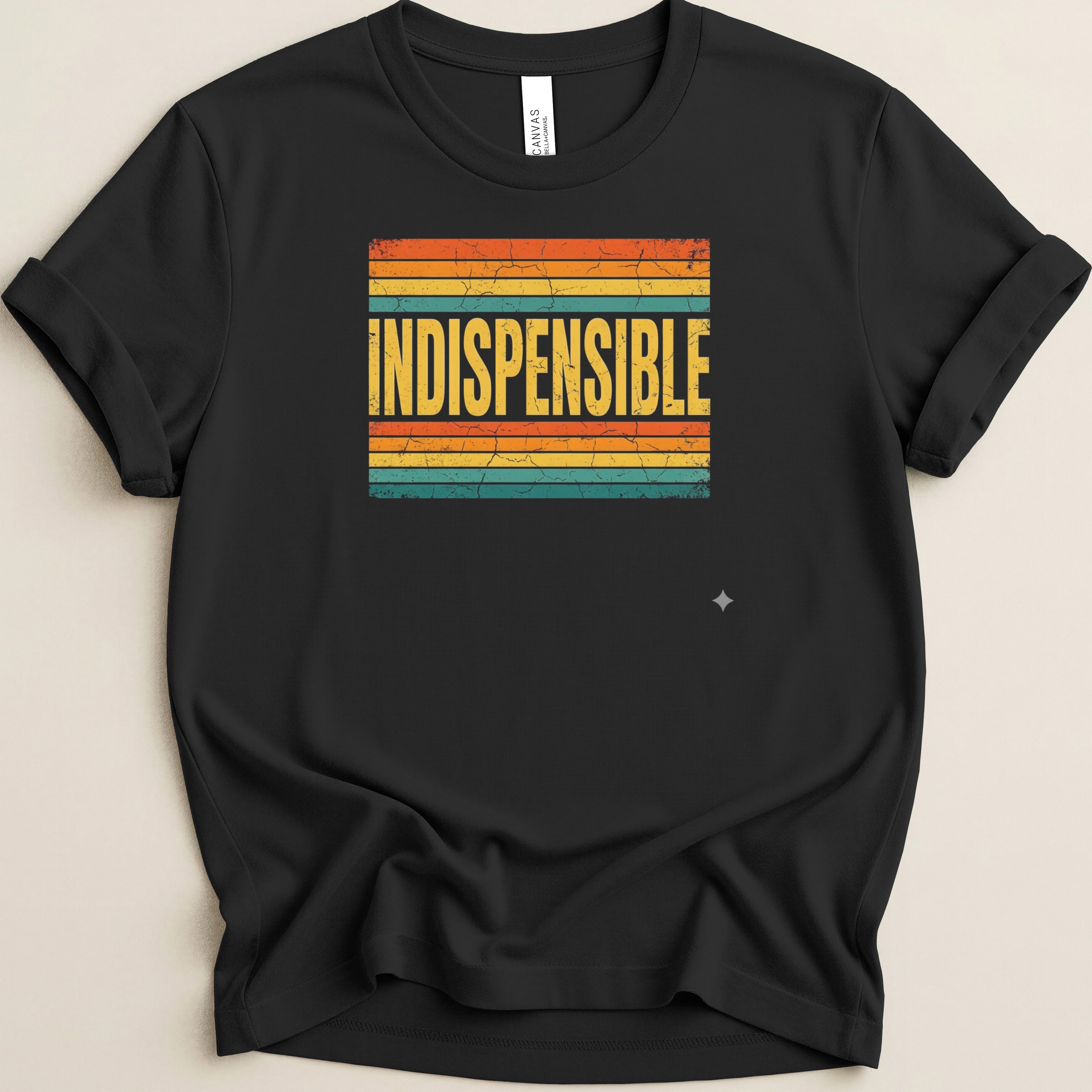 Black t-shirt with the word "INDISPENSBLE" in yellow on a striped background.