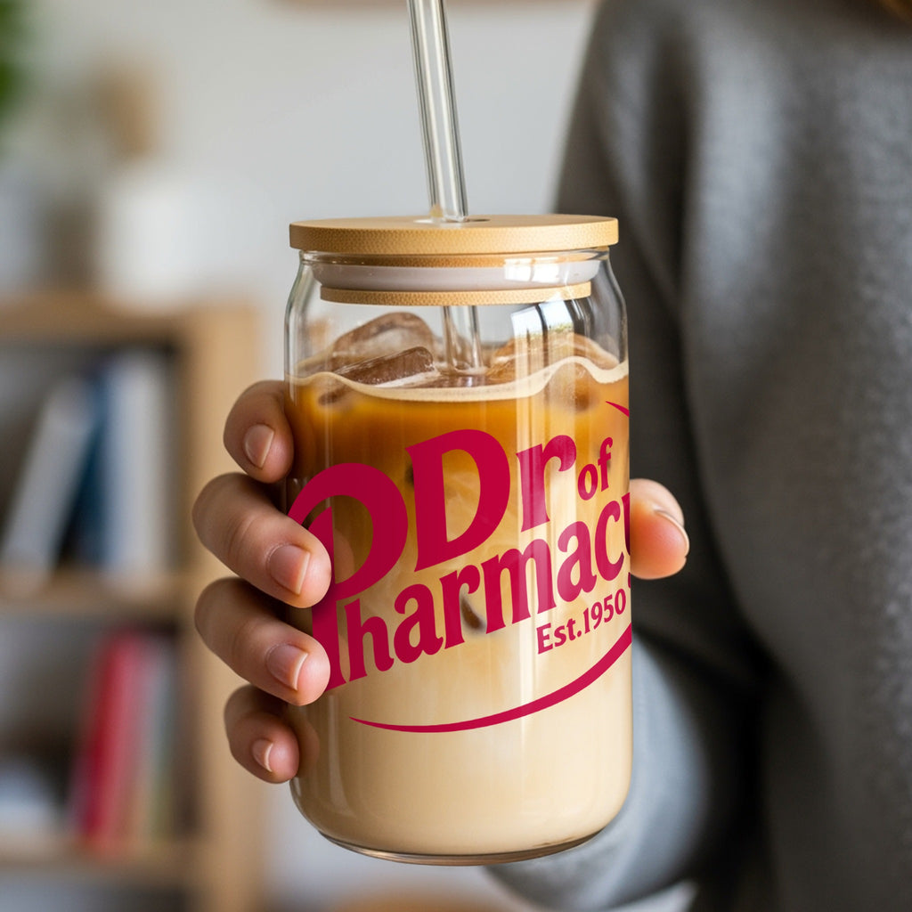 Glass tumbler with "Dr of Pharmacy Est. 1950" logo holding iced coffee.