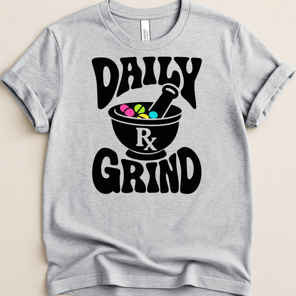 Grey t-shirt with black text "DAILY RX GRIND" and a mortar and pestle with pills.