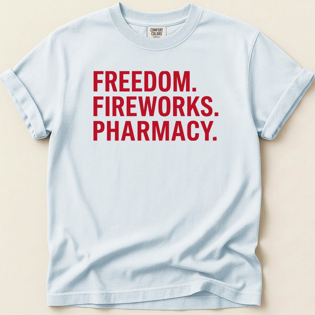 Light blue t-shirt with red text: FREEDOM. FIREWORKS. PHARMACY.