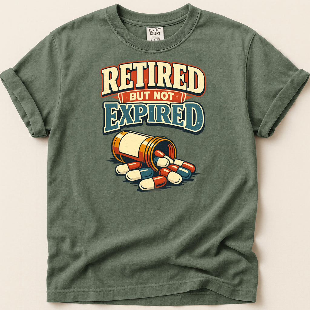 T-shirt with text "RETIRED BUT NOT EXPIRED" and a bottle of pills.