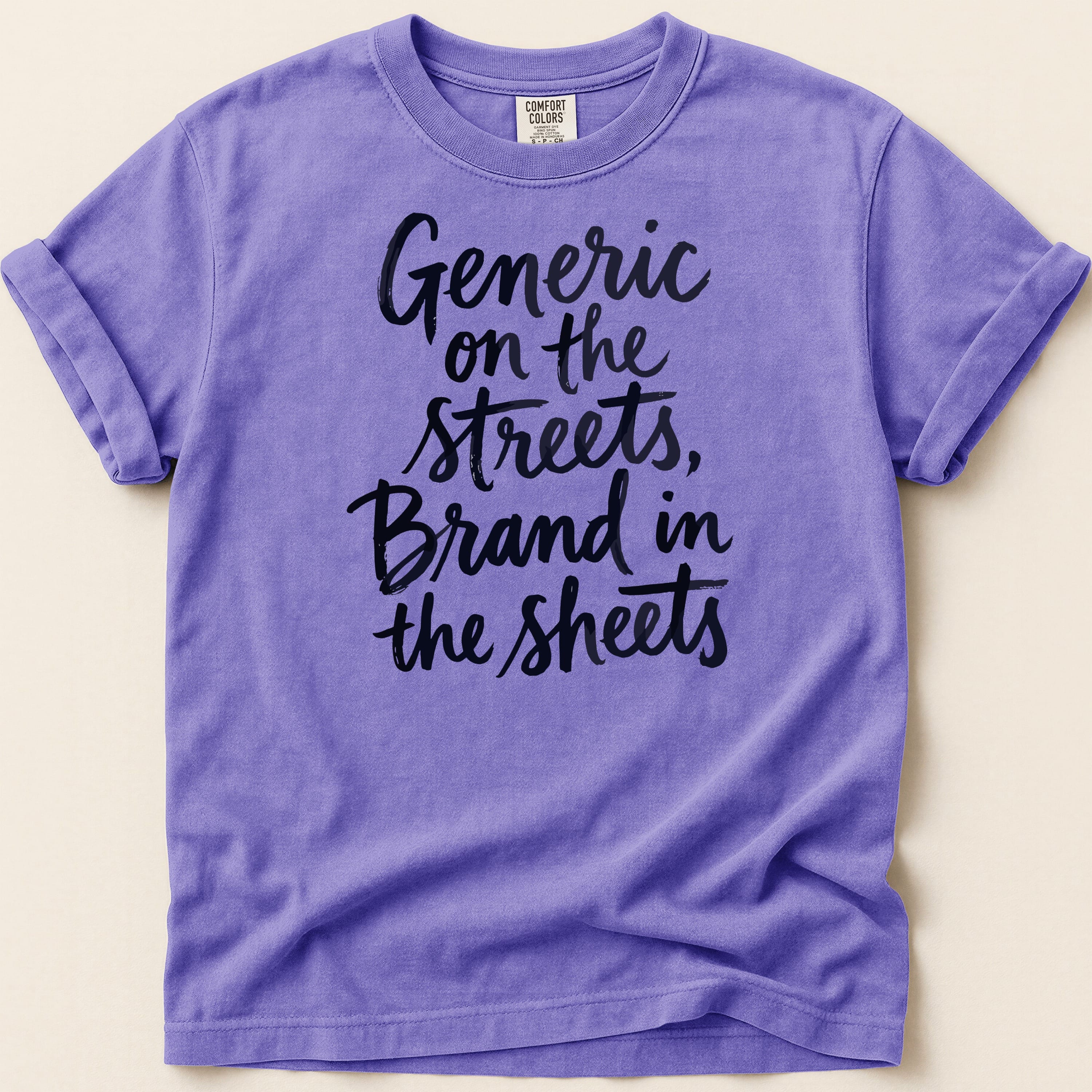 Purple t-shirt with black text "Generic on the streets, Brand in the sheets".