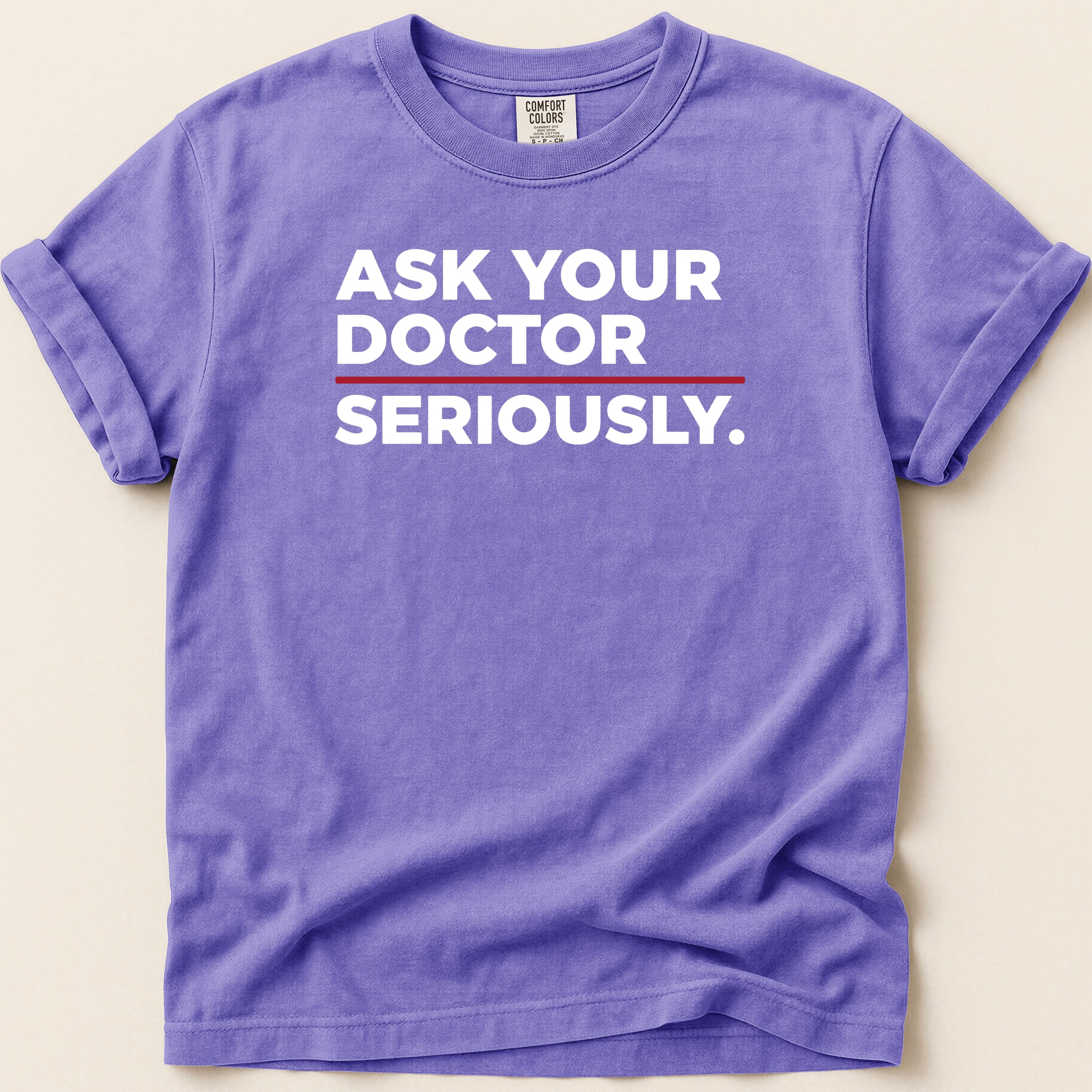 Purple t-shirt with white text "ASK YOUR DOCTOR SERIOUSLY."