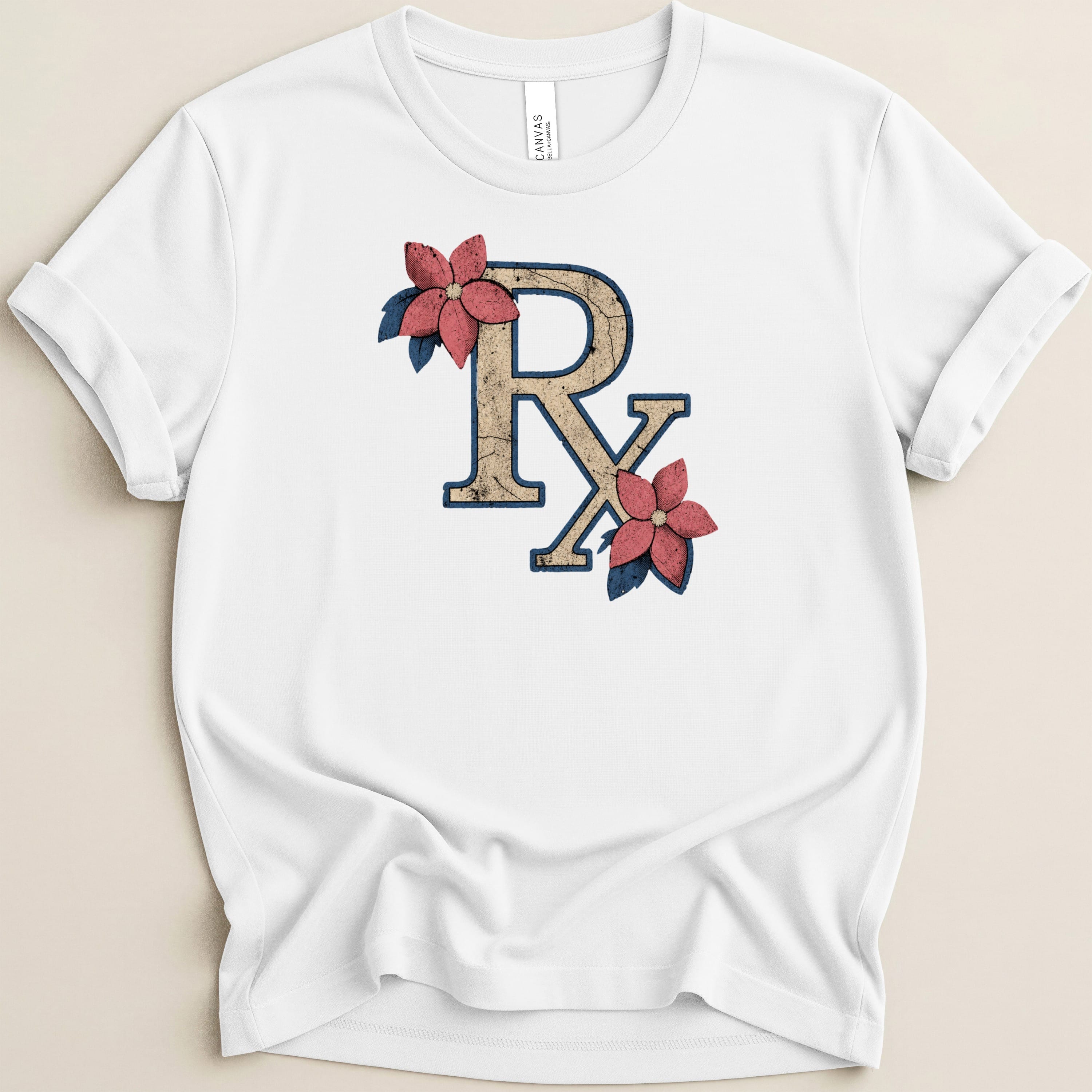 White t-shirt with distressed "RX" symbol accented by flowers and leaves.