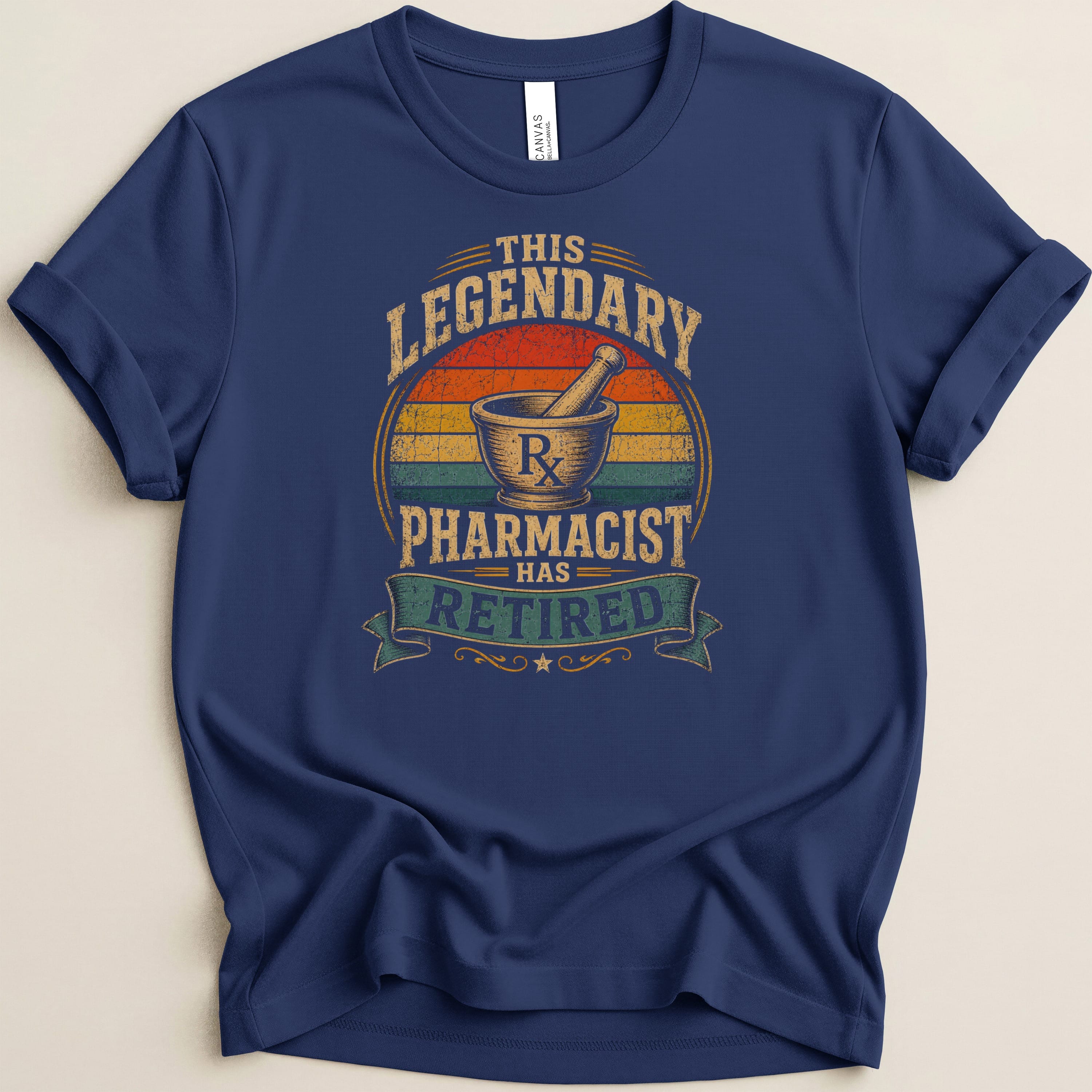 Navy t-shirt with "This legendary pharmacist has retired" text and mortar and pestle graphic.