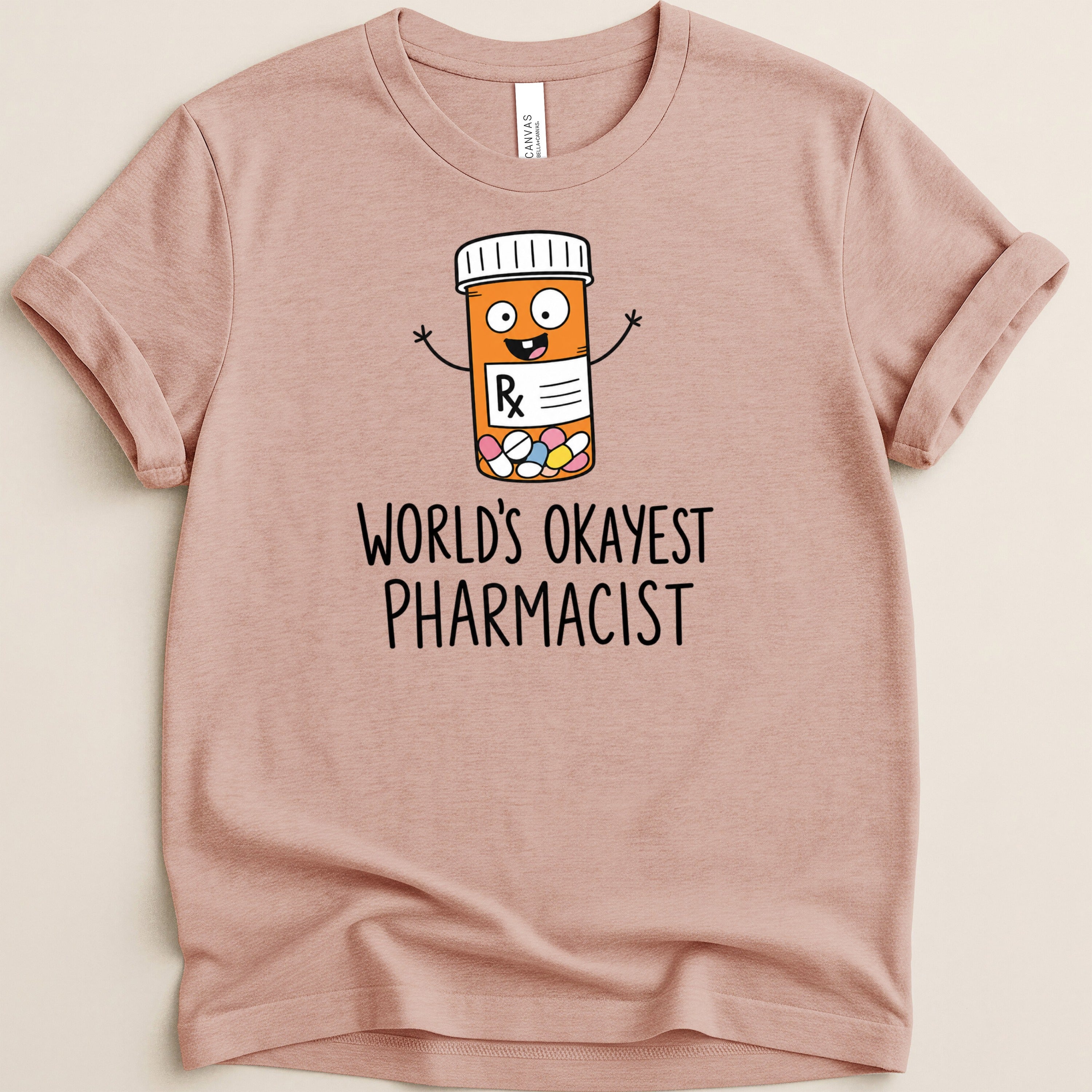 T-shirt with cartoon pill bottle and text "World's Okayest Pharmacist".