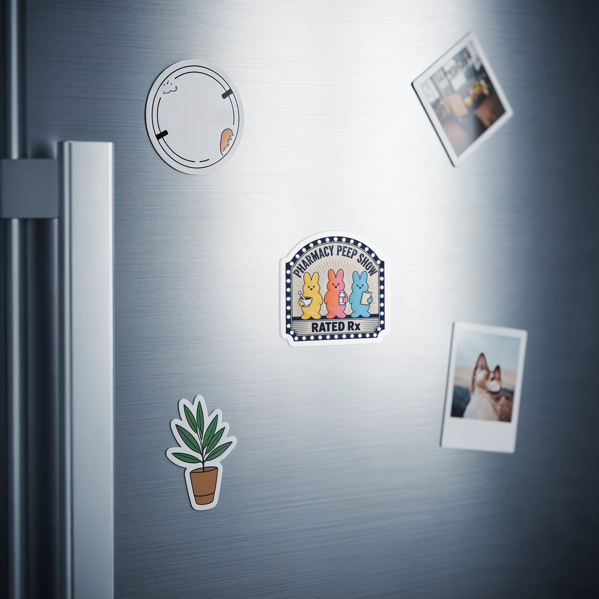Pharmacy Peep Show Rated Rx sticker with four cartoon bunnies and a plant sticker on a refrigerator.