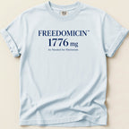 Light blue t-shirt with "FREEDOMCIN 1776 mg As Needed for Patriotism" text.