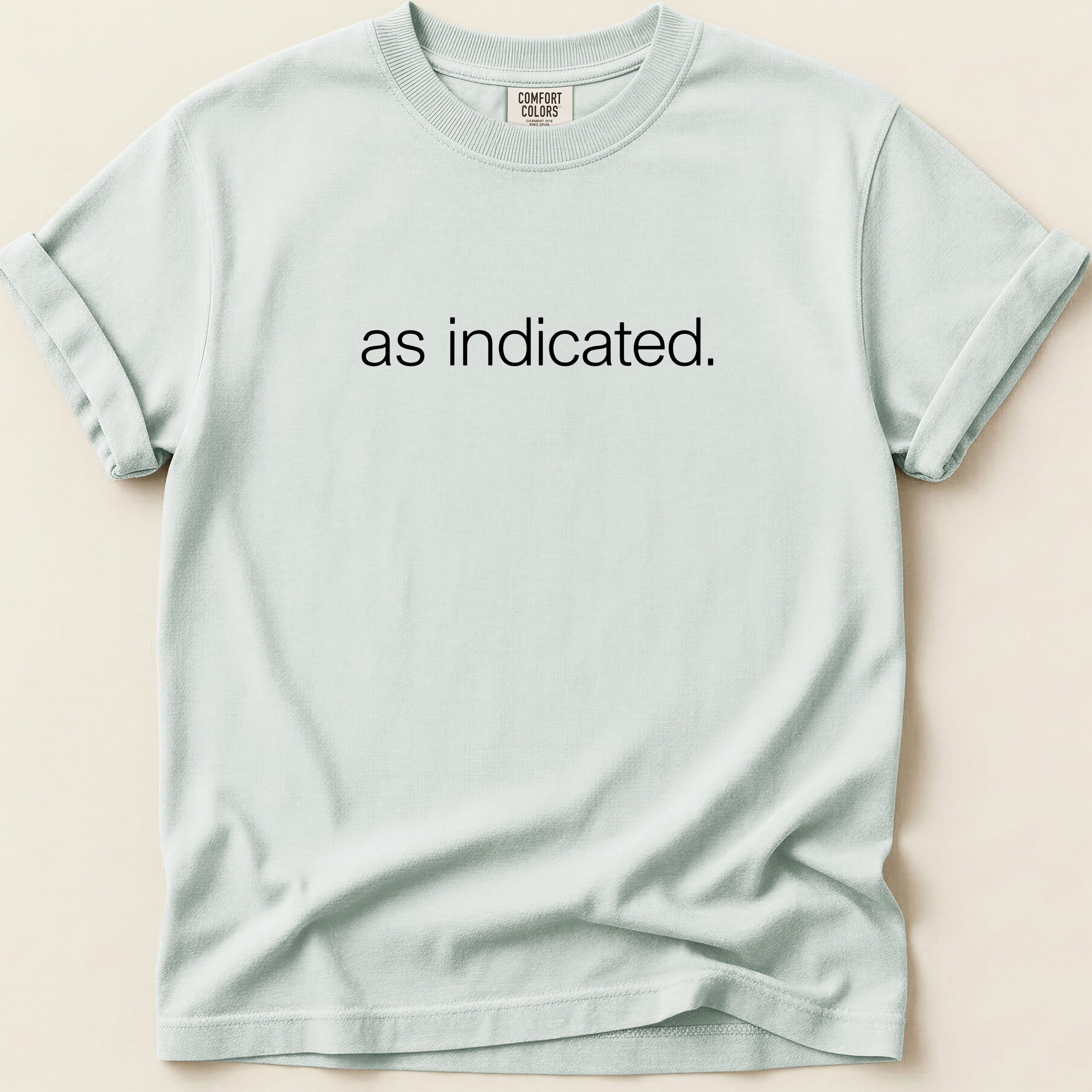 Light blue t-shirt with "as indicated." printed in black text.