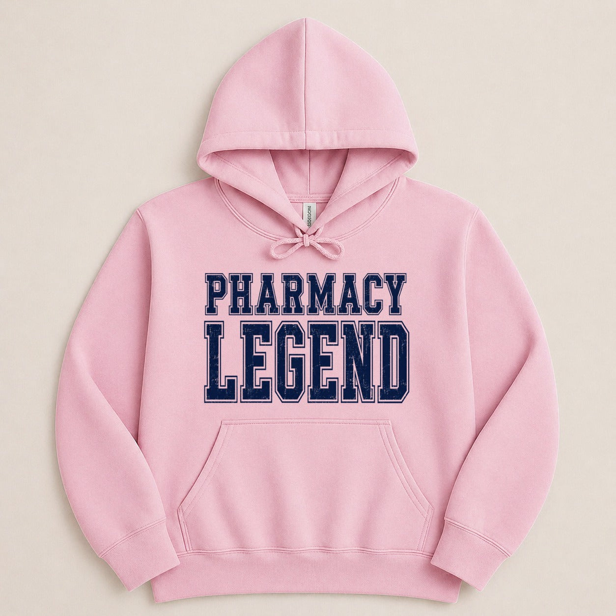 Pink hoodie with "Pharmacy Legend" in navy blue collegiate-style lettering.