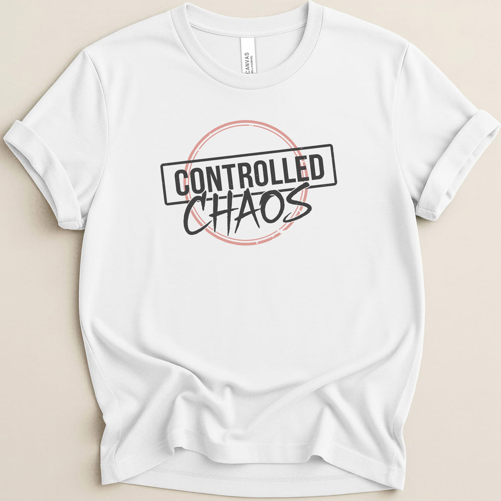 White t-shirt with "CONTROLLED CHAOS" in a black rectangle with a pink outline.