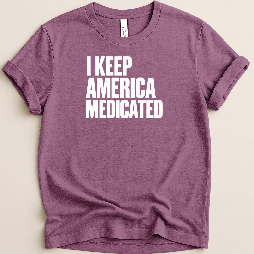 Purple t-shirt with white text "I KEEP AMERICA MEDICATED".