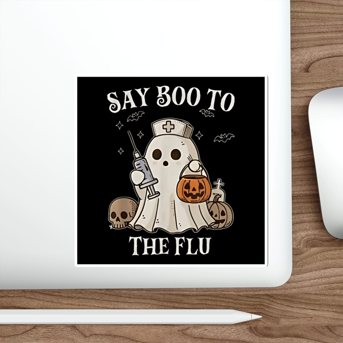 Ghost nurse costume saying "Say Boo to The Flu" with Halloween decorations.