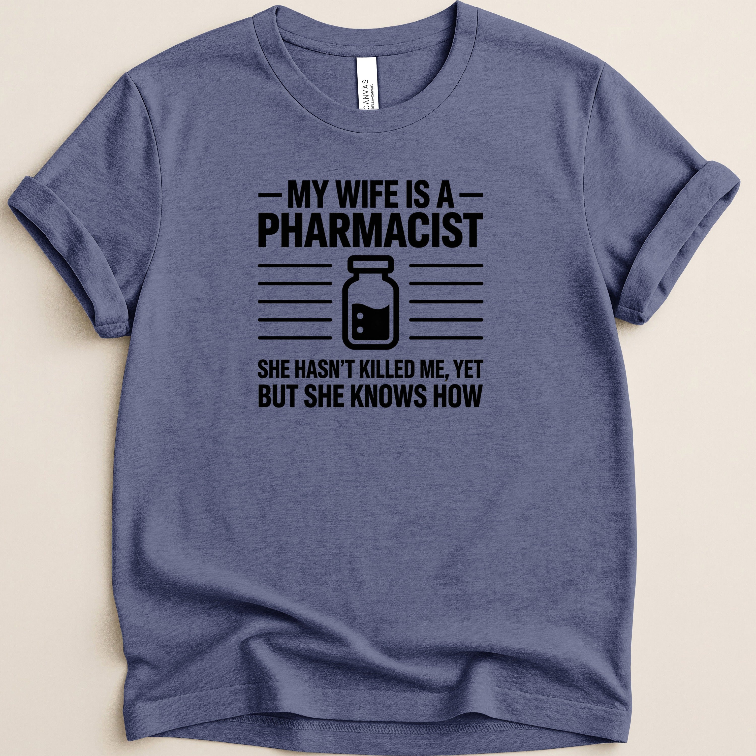Navy t-shirt with "My wife is a pharmacist. She hasn't killed me, yet but she knows how."