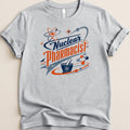 Grey t-shirt with "Nuclear Pharmacist" text and atom graphics.