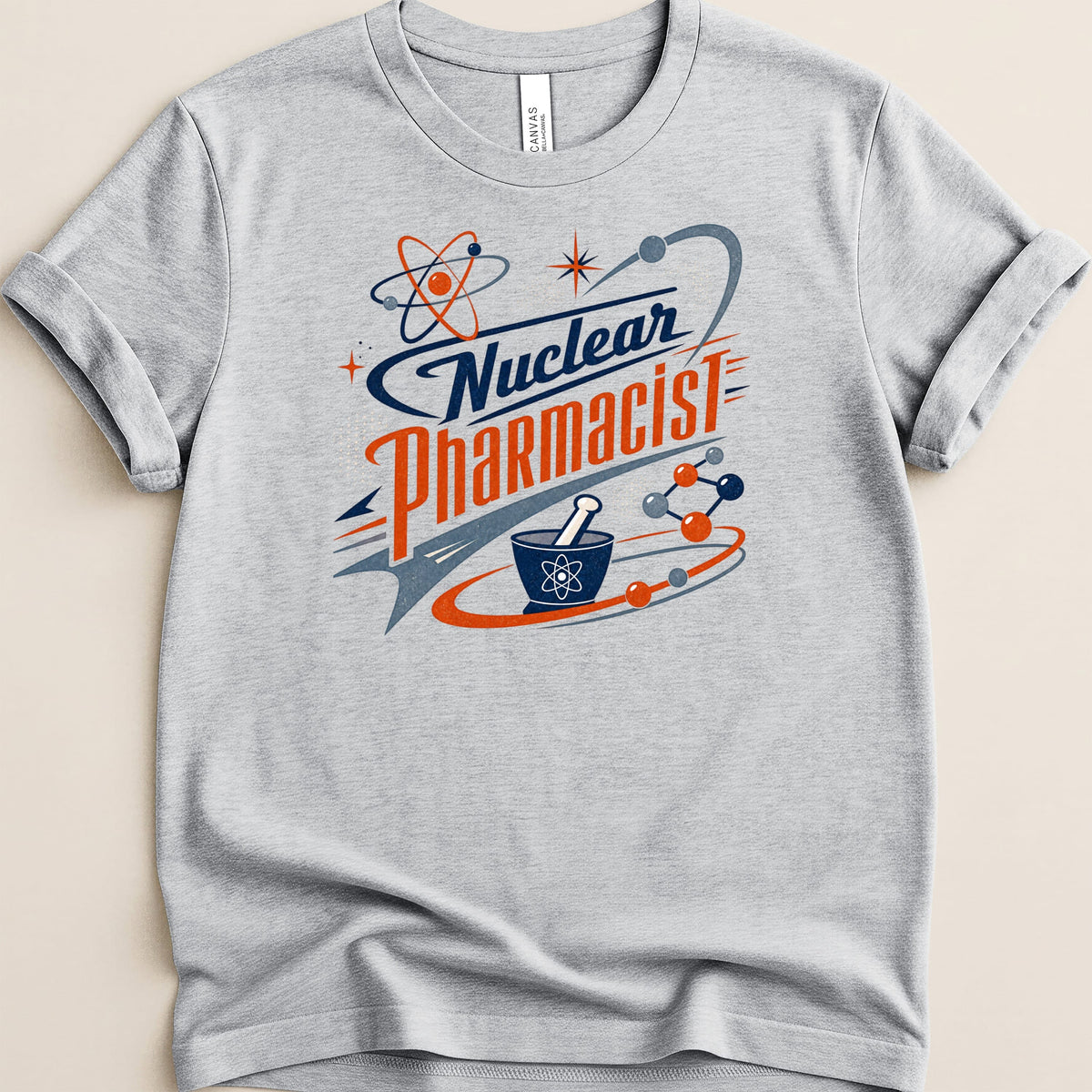 Grey t-shirt with "Nuclear Pharmacist" text and atom graphics.