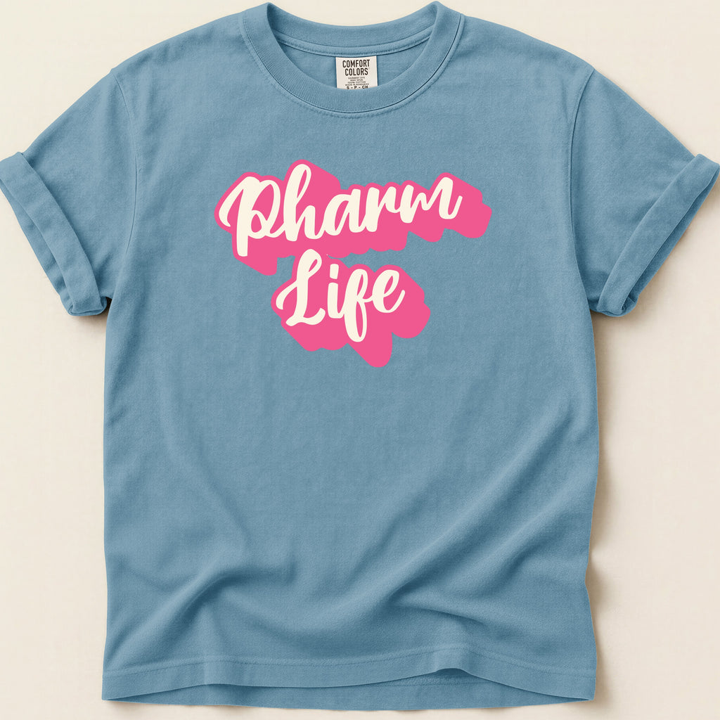 Blue Comfort Colors t-shirt with "Pharm Life" in pink script.