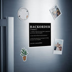 Black magnet with "BACKORDER" definition in white text.