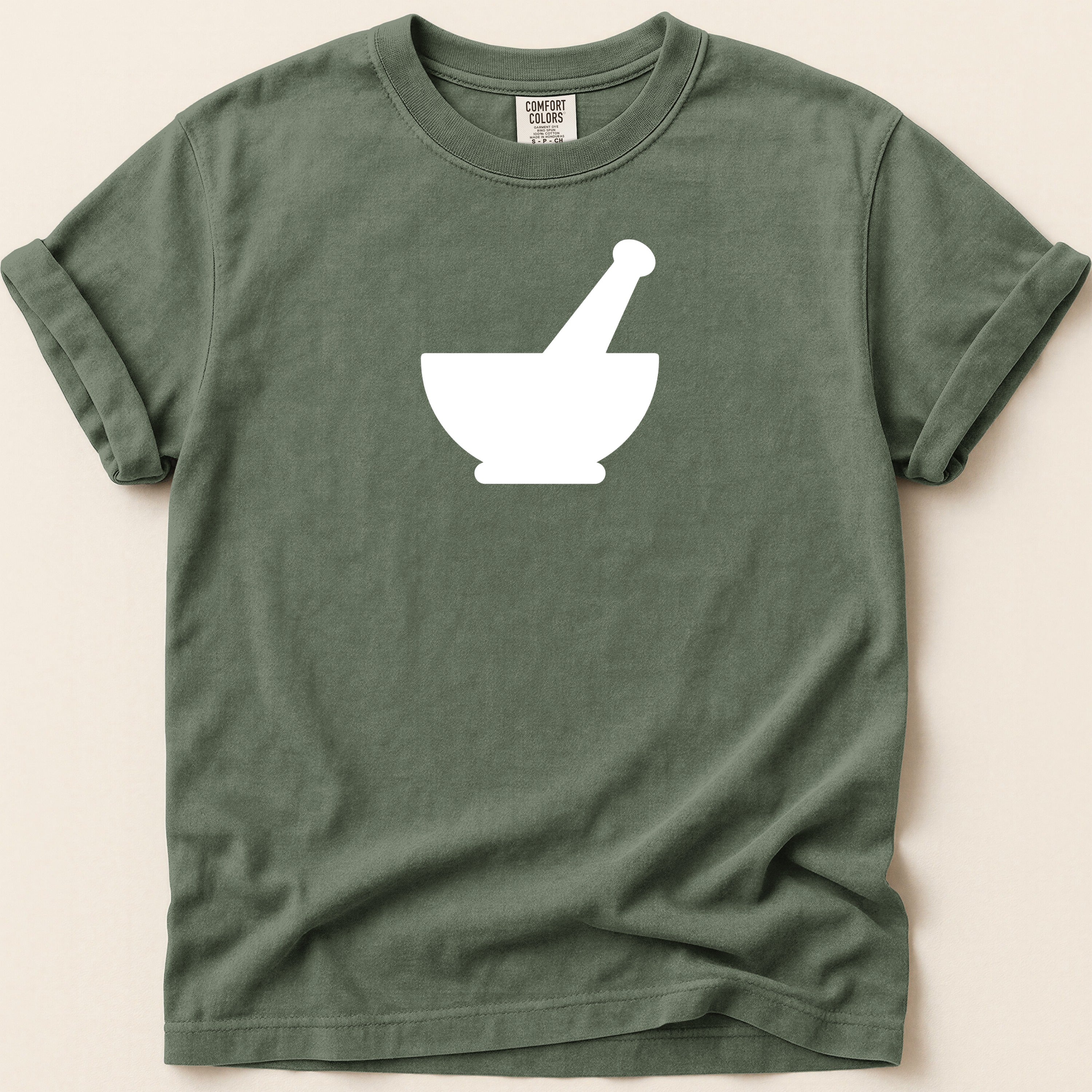 Green t-shirt with white mortar and pestle graphic and Comfort Colors tag.