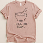T-shirt with a mortar and pestle graphic and text "I LICK THE BOWL".