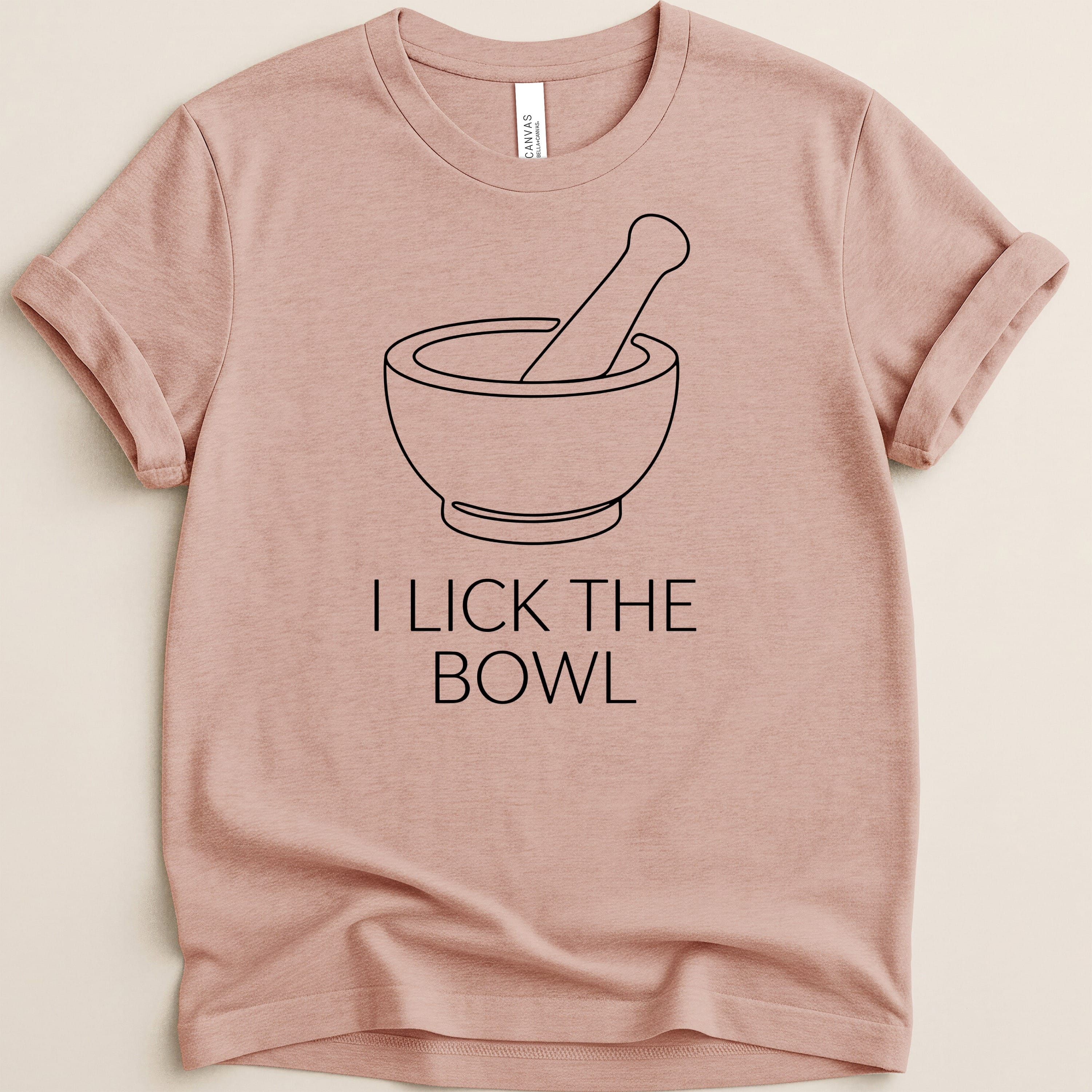 T-shirt with a mortar and pestle graphic and text "I LICK THE BOWL".
